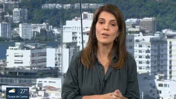 Mariana Gross não conseguiu segurar a risada ao noticiar que um casal ficou preso em uma bolha inflável no mar - Reprodução/Globo