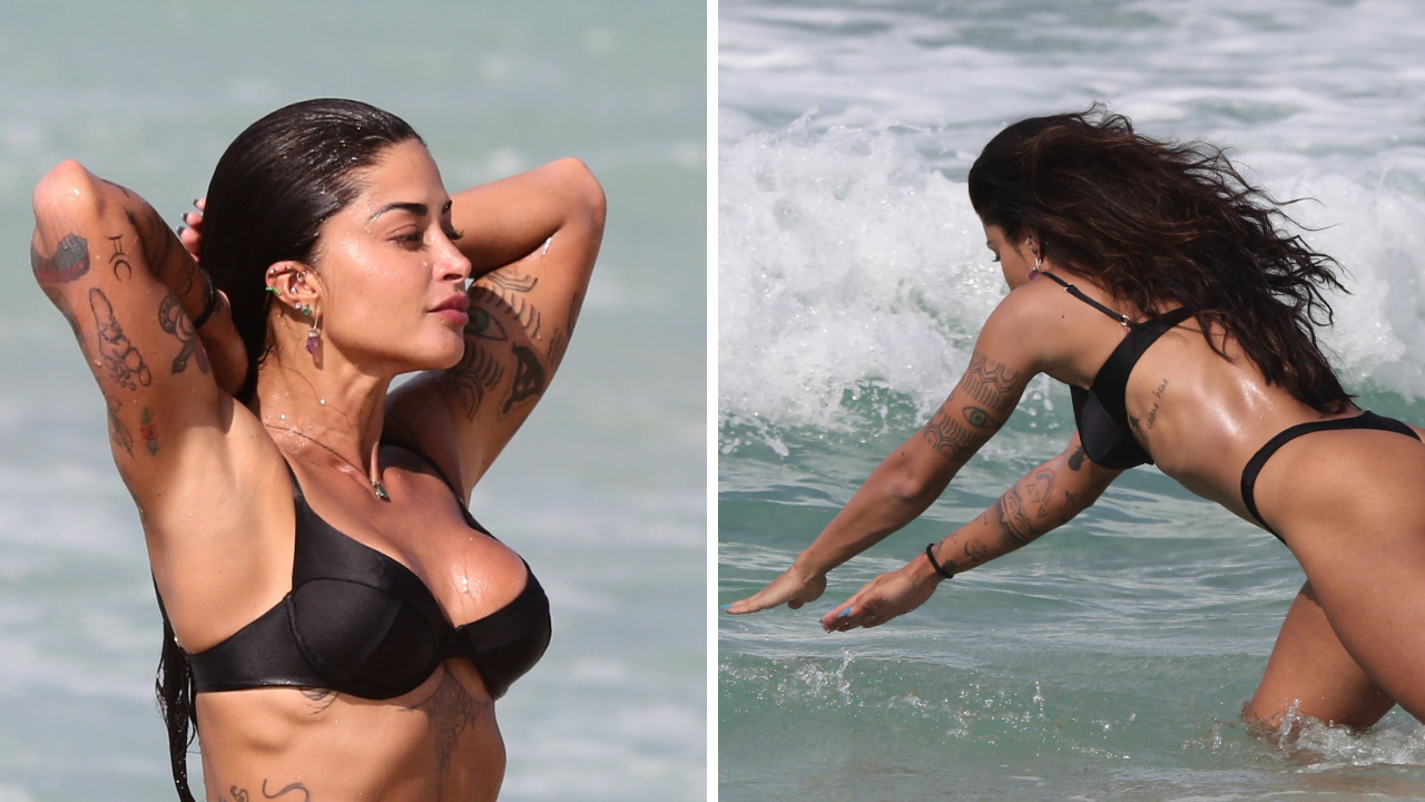 Mulherão! Aline Riscado desfila pelas areias, dá mergulho e deixa corpão em evidência com biquíni fio-dental