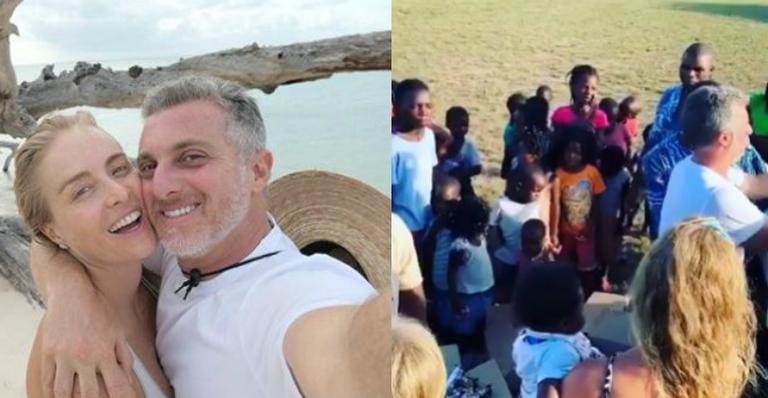 De férias pela África, Luciano Huck e Angélica doam presentes para crianças locais
