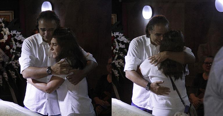 Glória Pires é consolada pelo filho de Lady Francisco no velório da atriz