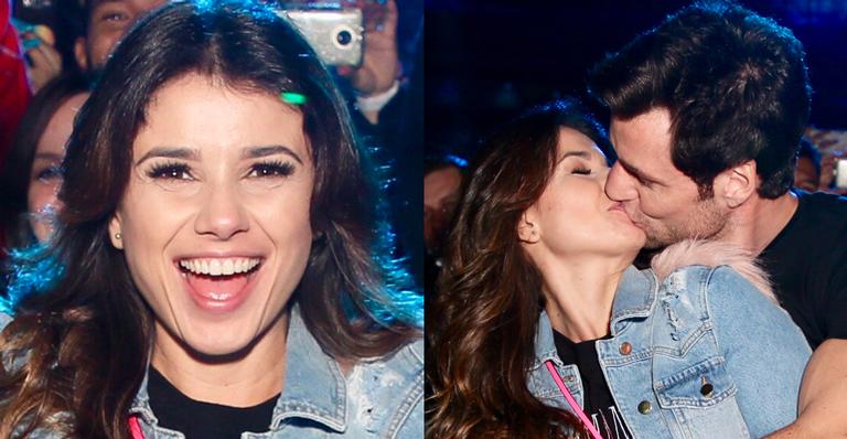 Paula Fernandes troca beijos apaixonados nos bastidores do show de Sandy & Junior