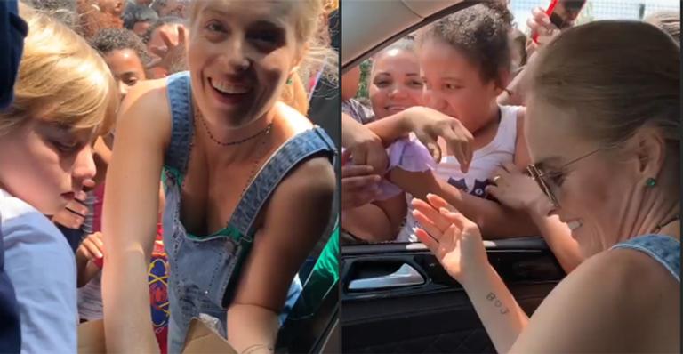 Luciano Huck e Angélica causam tumulto ao distribuírem doces no Rio de Janeiro