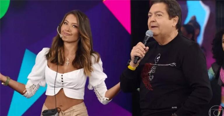 Assistente de palco do Domingão do Faustão surge de biquíni branco e ostenta boa forma