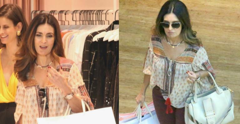Sozinha, Fátima Bernardes deixa shopping com várias sacolas de compras