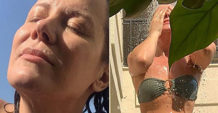 Aos 52 anos, Regina Volpato dá surra de beleza, toma chuveirada de biquíni e exibe corpaço